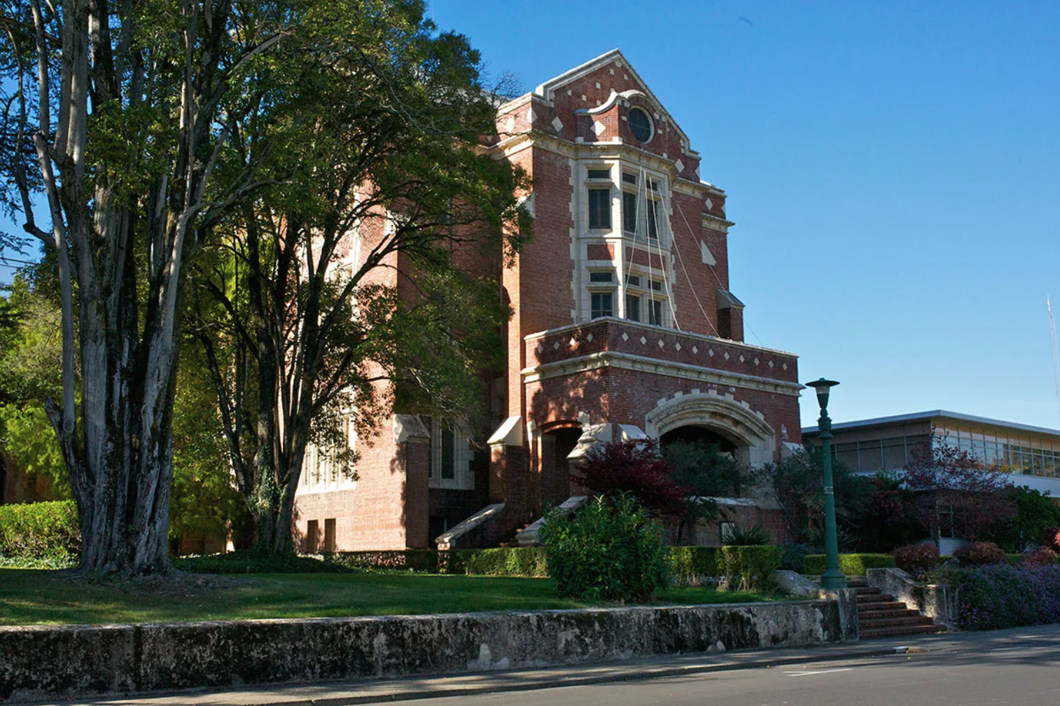 three-story red brick building